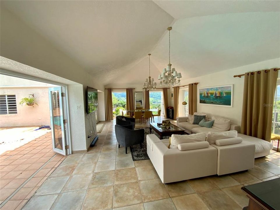 Folding doors open to refreshing pool area