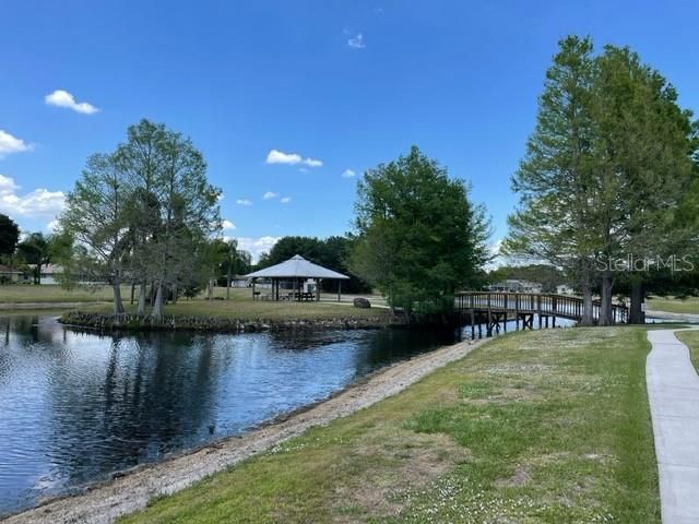 Wooden bridge leads to Assoc.private island with walking trail, shuffledboard, picnic area and barbecues.
