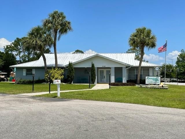 Clubhouse backs up to small lake with access to various canals. Screened porch and patio area in rear.