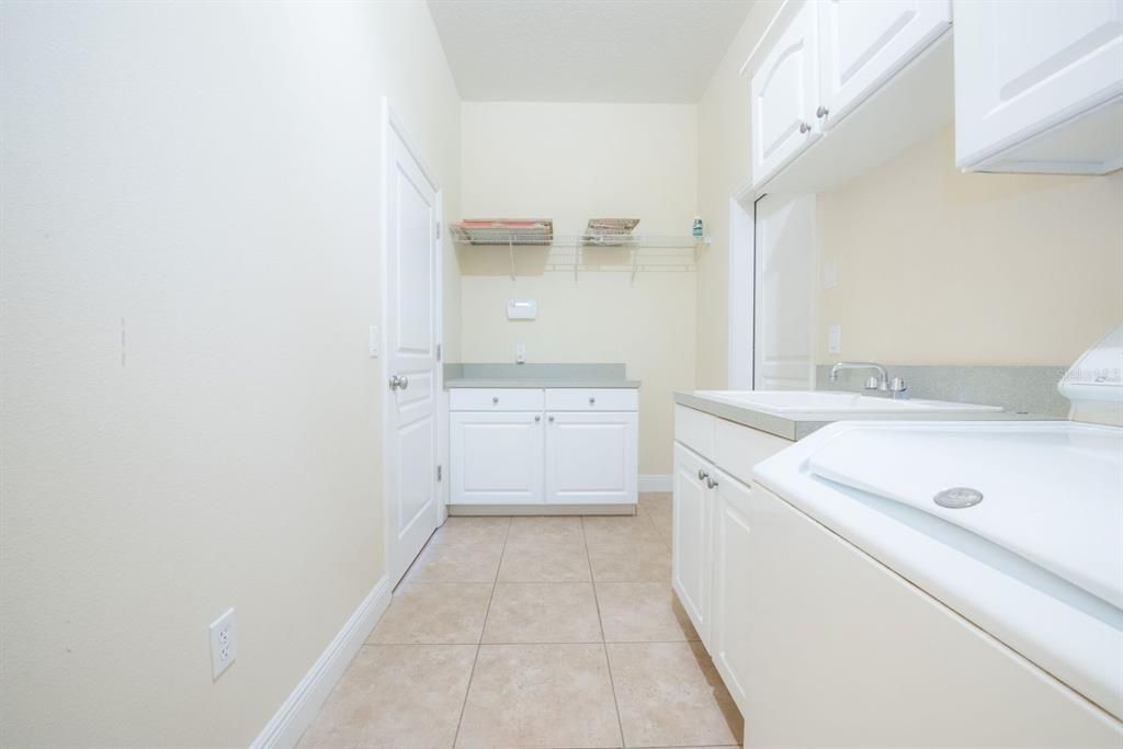 Utility room with cabinets galore.