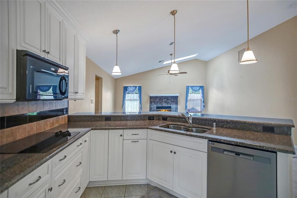 Cooktop with separate oven, Refrigerator, dishwasher and disposal... plus 2 built-in microwaves in this kitchen!