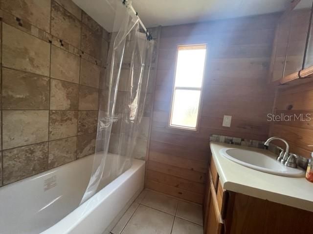 Bathroom - Cedar walls, single vanity, stub with shower