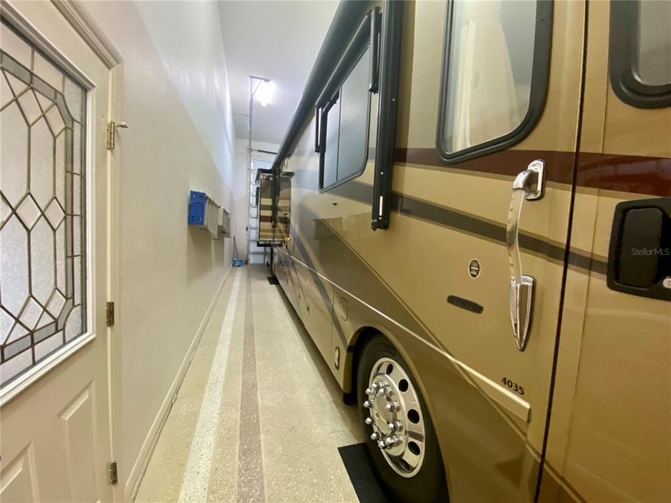 hallway door into RV and tandem car garage