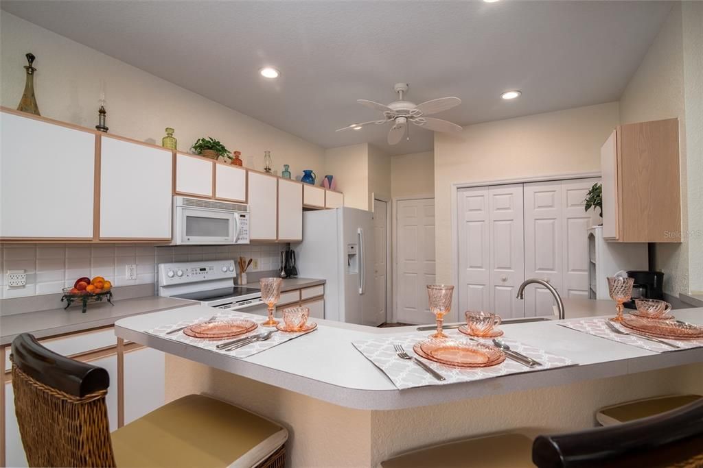 The chef friendly kitchen has ample cabinetry and counter space. A closet pantry is a plus.