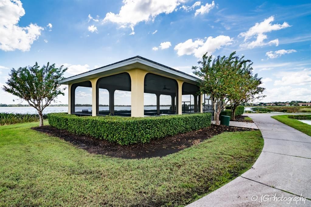 A screened gazebo is on the main clubhouse grounds and can be reserved for use by residents.