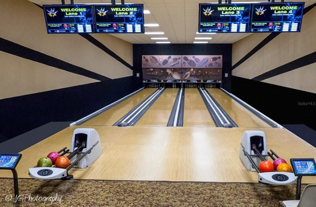 The main clubhouse bowling center has automatic scoring. House balls and shoes are available. Bowling is free for residents.