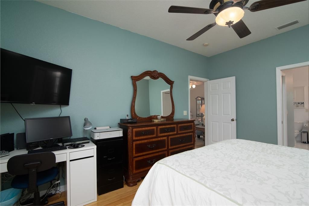The master suite has 2 walk-in closets in the hallway between the master bed and bath.