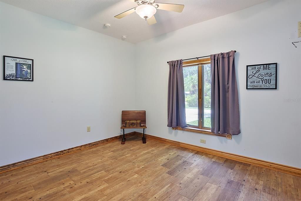 Guest room has walk-in closet and views of the front yard!