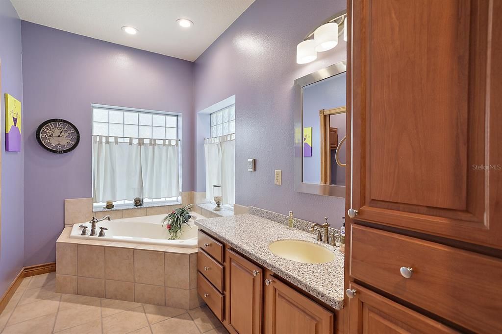 Jetted soaking tub in addition to shower.  Enjoy privacy with glass block that allows natural lighting to enter.