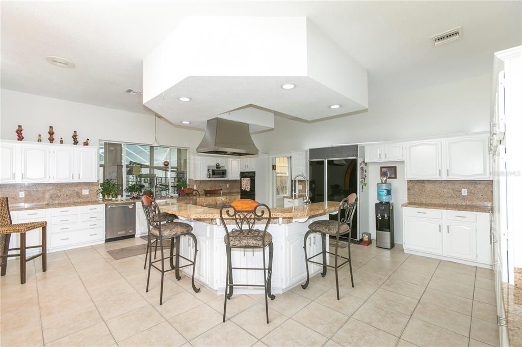 Enjoy Gourmet Cooking in this HUGE Kitchen with Double Ovens, Island with Smooth Cooktop, and Tons of Cabinets