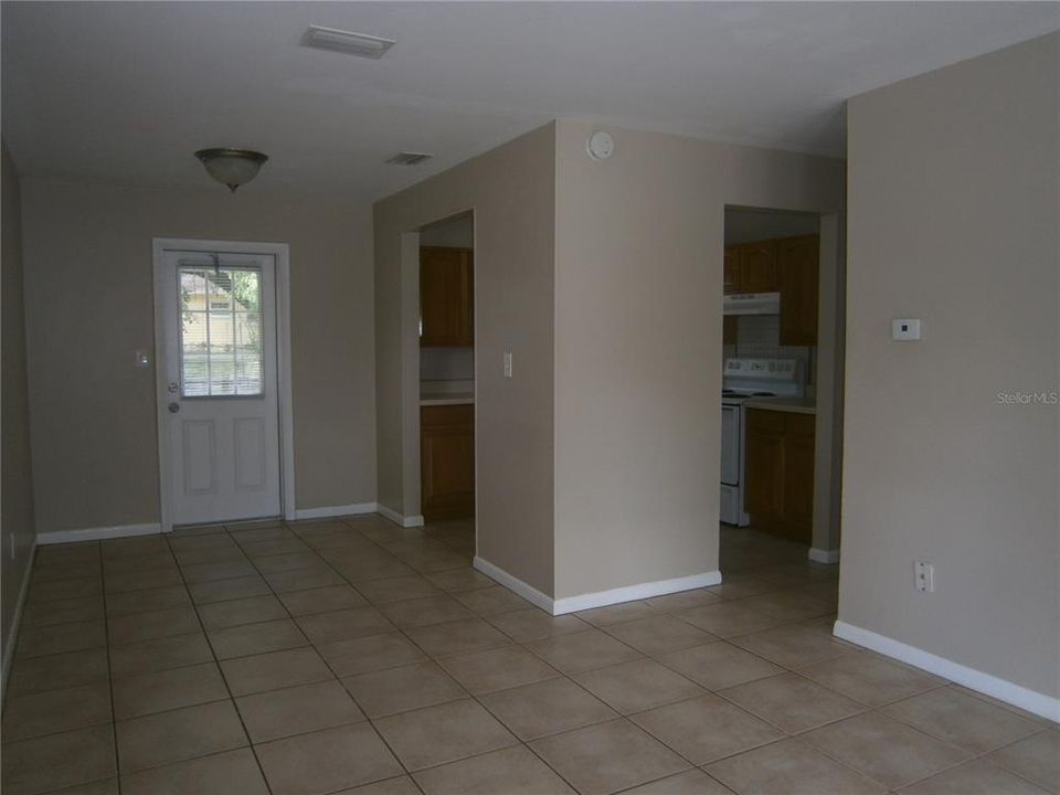Kitchen with two entrances and door is to backyard.