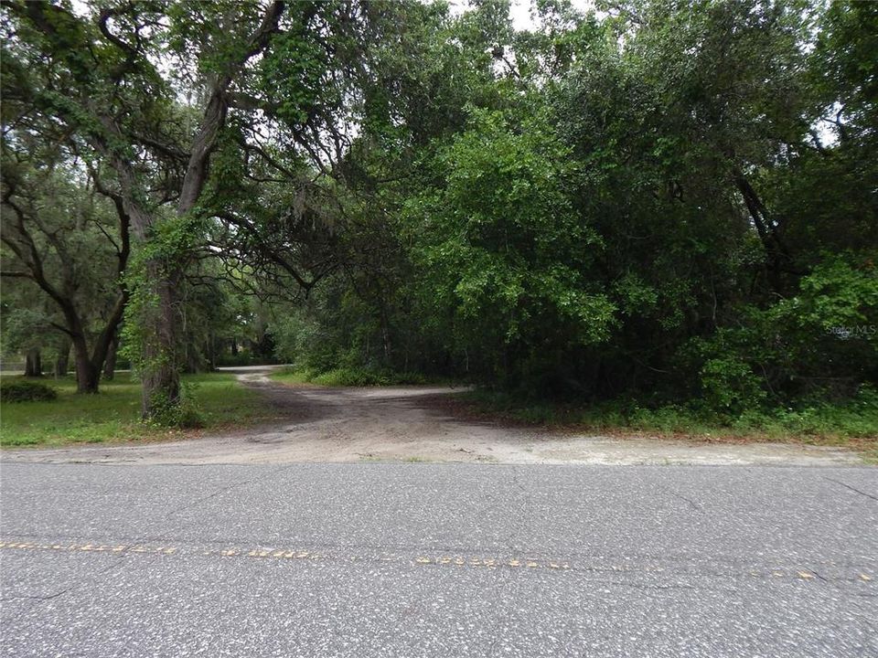 FROM FISHERMANS ROAD, PAVED ROAD, LOT 98 ON RIGHT, DESIGNATED TRIANGLE PARK ON LEFT