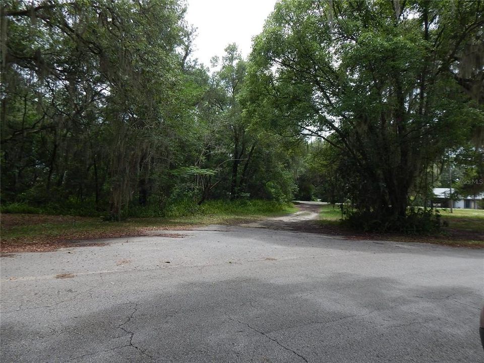 FROM SUNSET DRIVE, PAVED ROAD, LOT 98 ON LEFT, DESIGNATED TRIANGLE PARK ON THE RIGHT