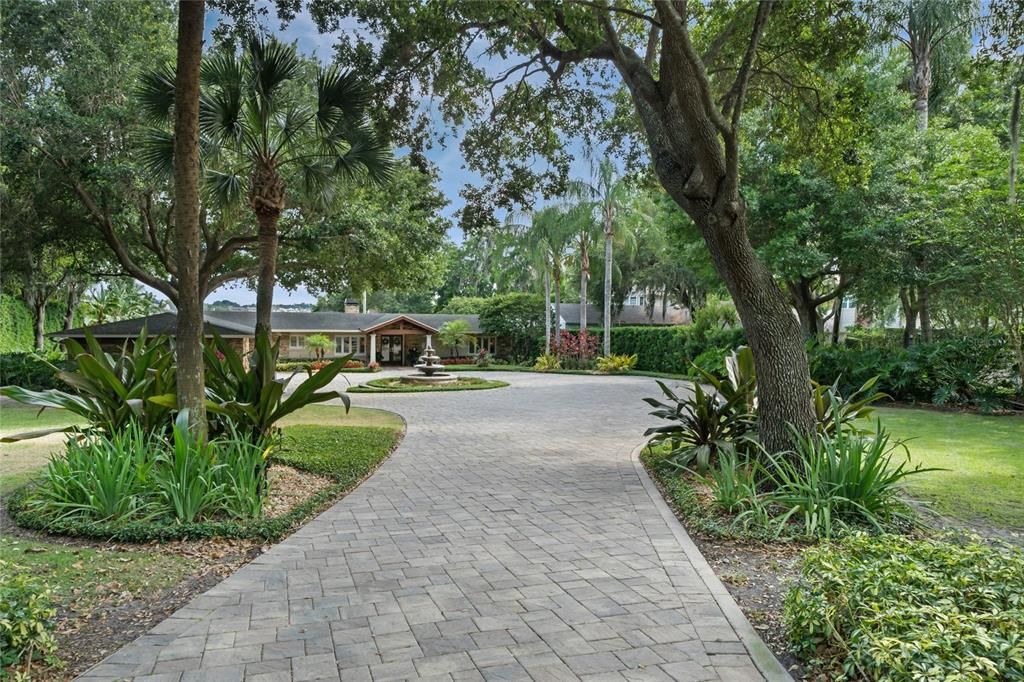 Pavered driveway, private manicured yard