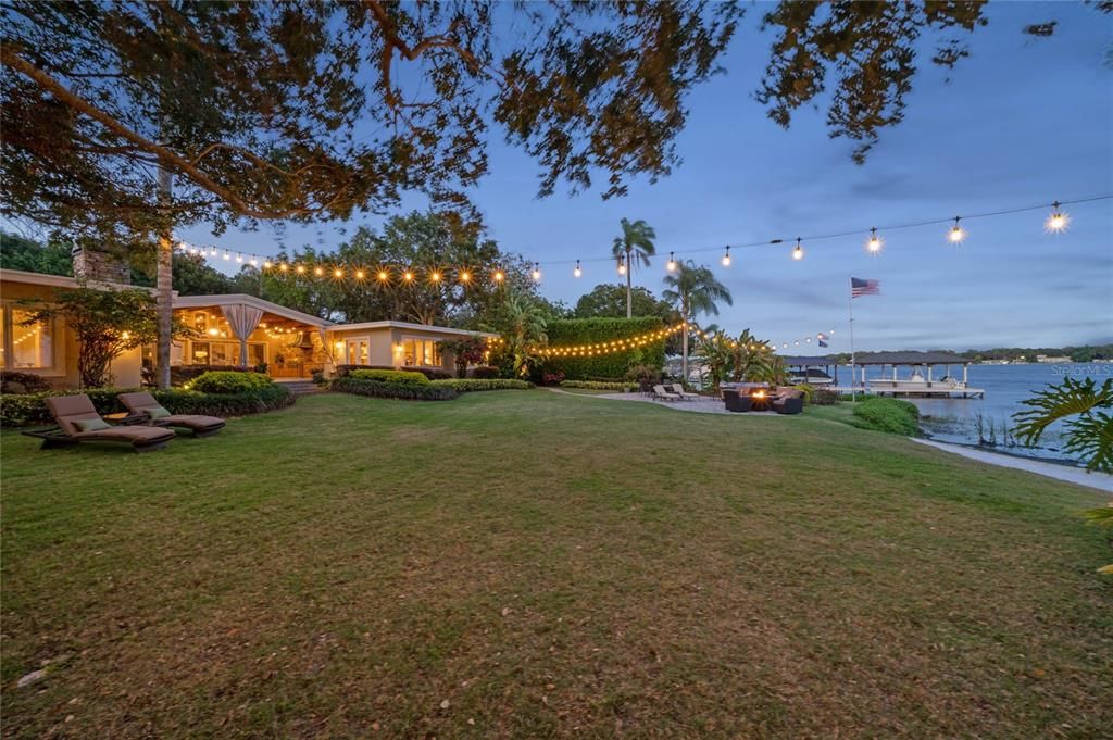 Private manicured spacious yard with twinkly lights