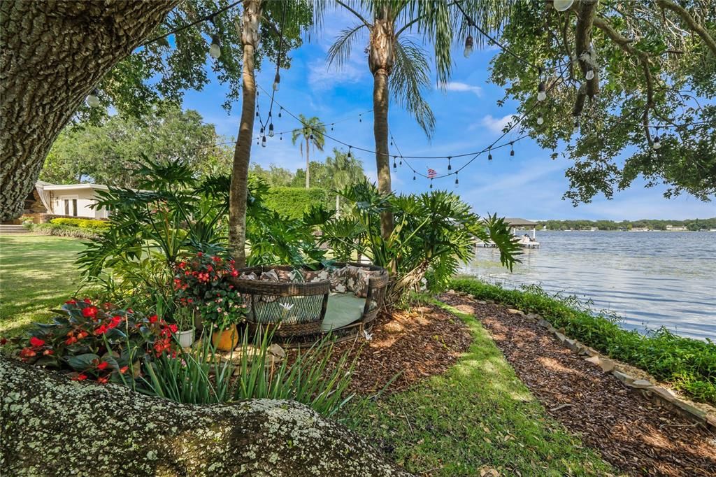 Private lakefront gardens with twinkly lights