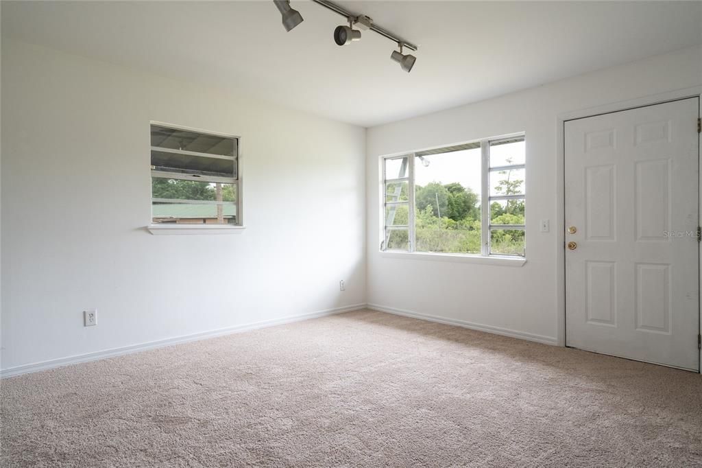 Living room towards door leading to the canal to lake.