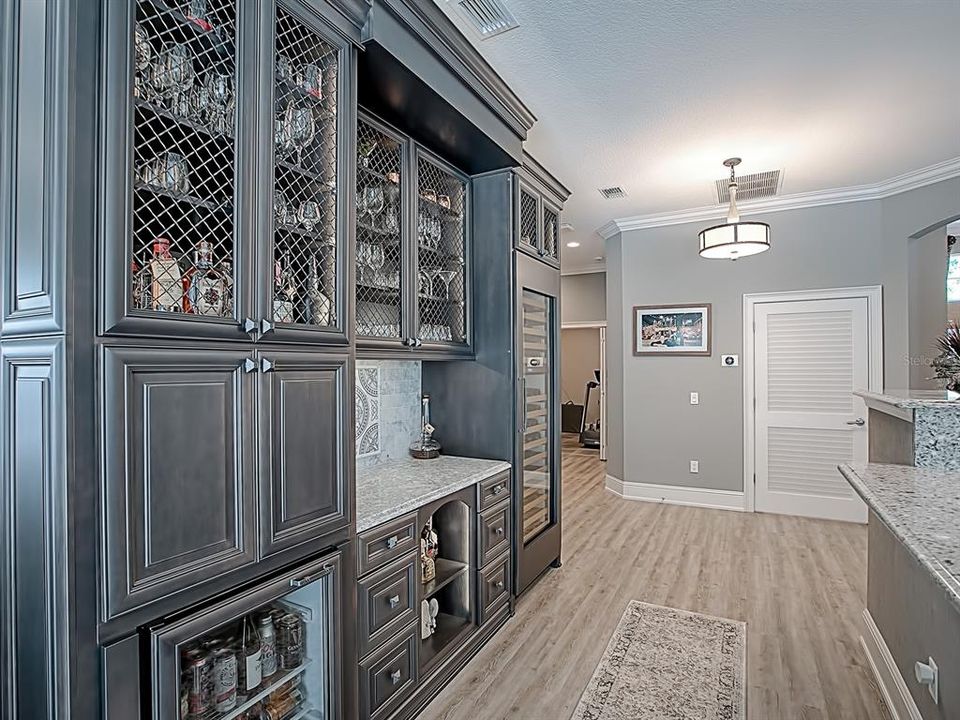 THE LEFT LEADS TO THE WORKOUT ROOM AND GUEST ROOMS!  THE LOUVERED DOOR LEADS TO THE LAUNDRY ROOM!