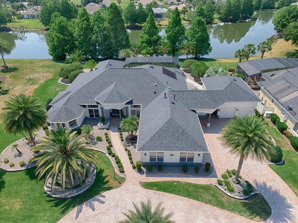 GORGEOUS ST. AUGUSTINE PREMIER WITH 4 BEDROOMS, 3.5 BATHS, HEATED POOL, LAKE VIEW, 4 CAR + TANDEM GOLF CART GARAGE IN THE VILLAGE OF GLENBROOK/SUNBURY!