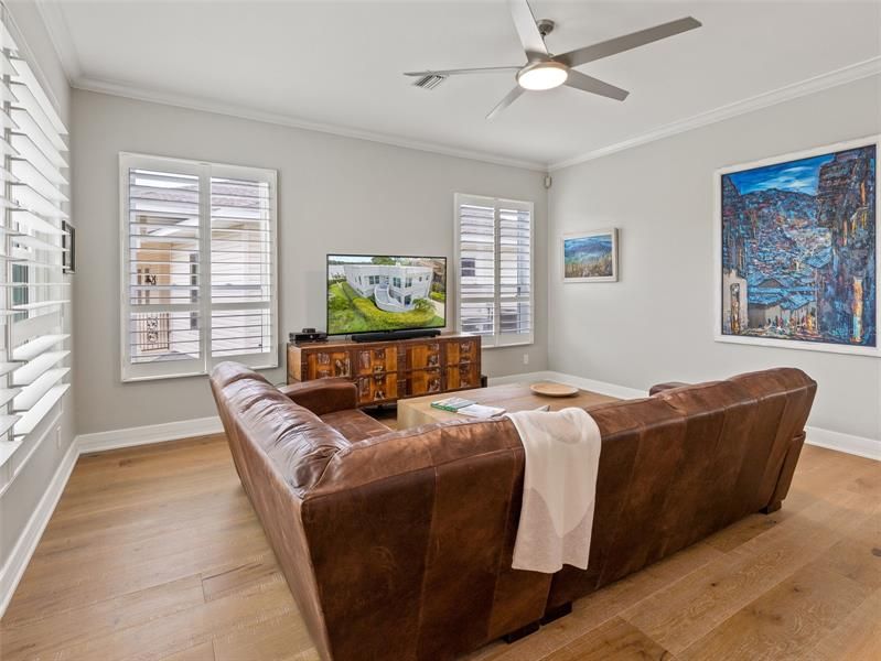 TV/Living area, oak floors, modern fan