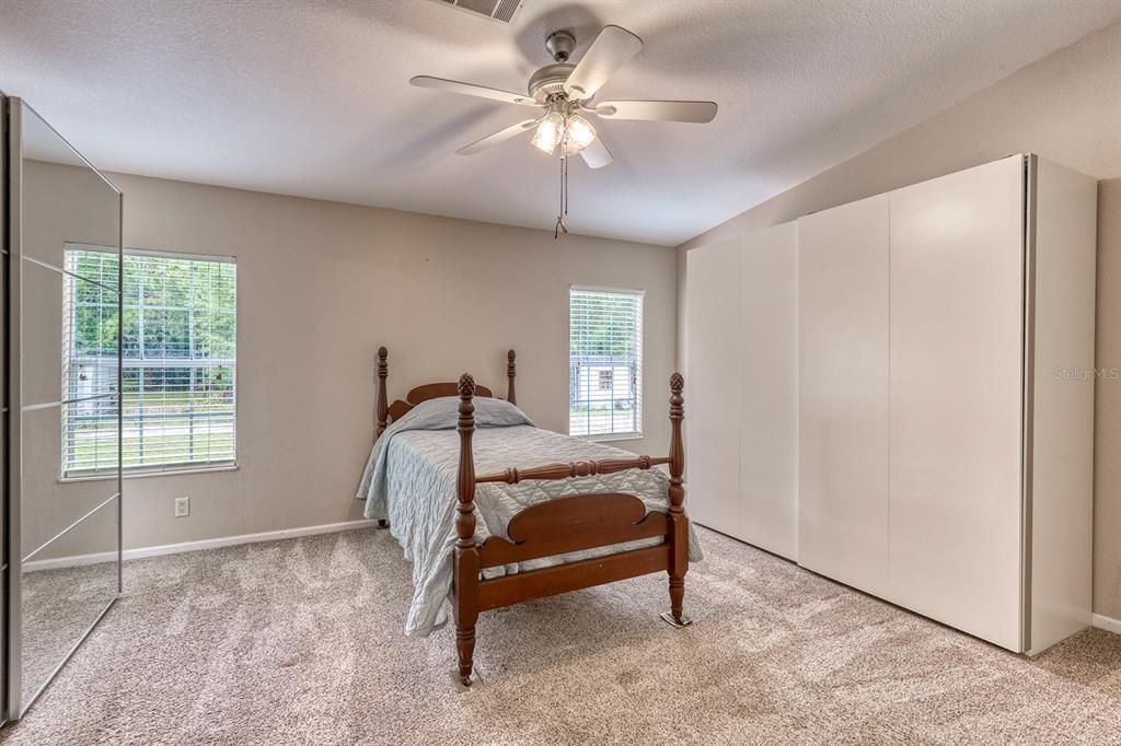 Primary bedroom with 2 armoire that convey