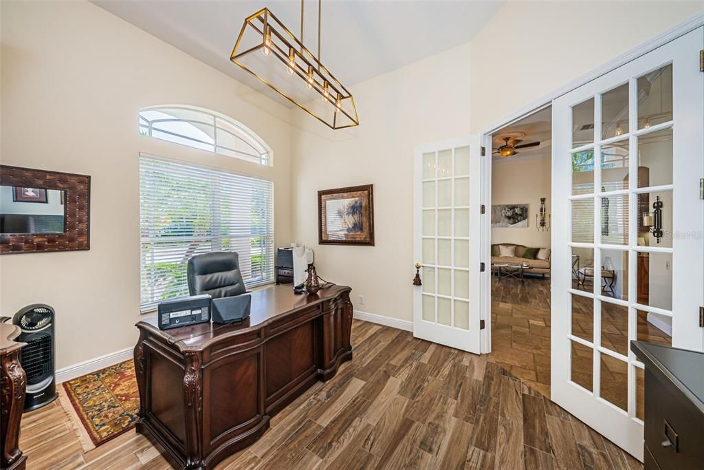 Don't miss the beautiful French Doors & that Light Fixture!