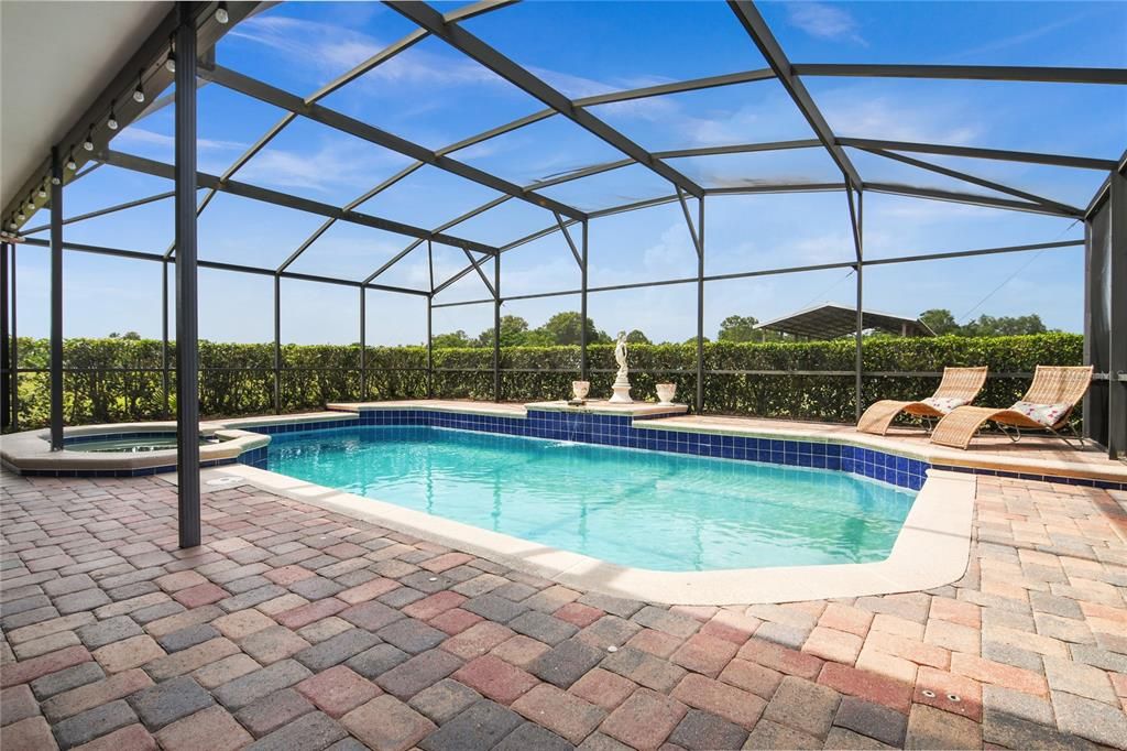 When you are not out exploring the property you can relax POOLSIDE under the covered LANAI or spend the day splashing in the sparkling pool surrounded by hedges for privacy!