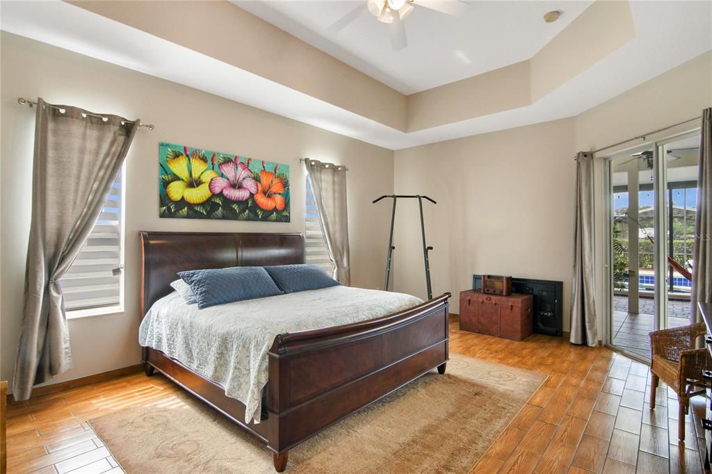 The ideal 3-way split delivers a sanctuary in the PRIMARY SUITE highlighted by the TRAY CEILINGS, direct access to the lanai, WALK-IN CLOSET and grand EN-SUITE BATH!