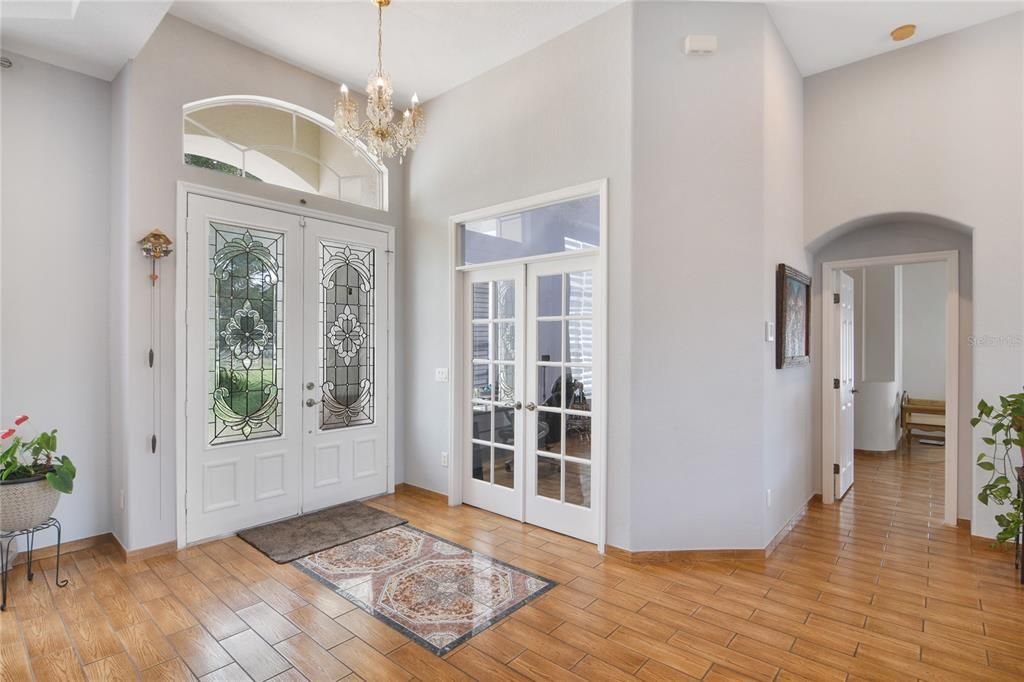 Behind FRENCH DOORS a private home office or a perfect 5th bedroom!