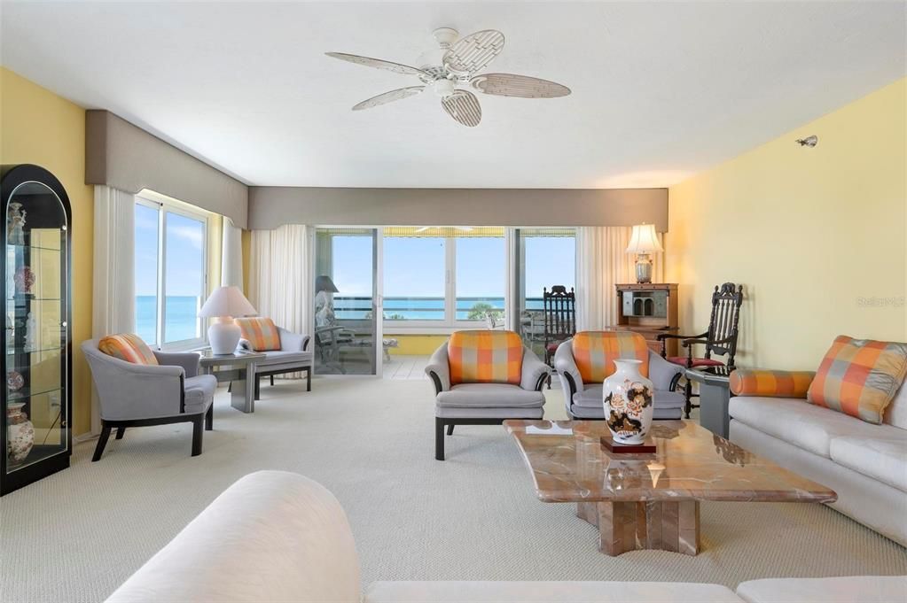 Great room with expansive slider to Florida room and direct westerly Gulf view