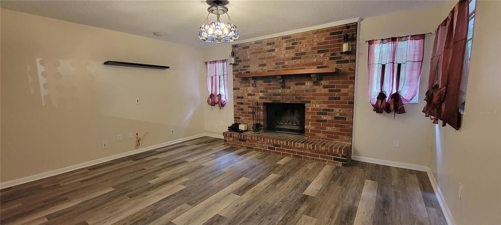 Family room with wood burning fireplace