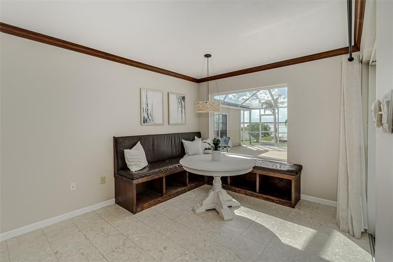 Dinette area with a picture window to let you enjoy views of the lake.  You can also see the 242 sf bonus room thru the window.