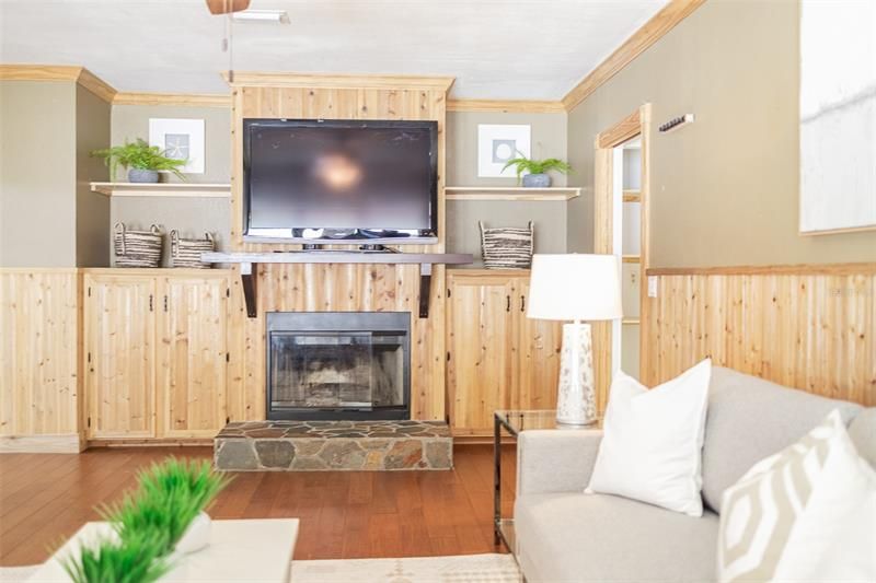 Relax and unwind in front of the wood burning fireplace.  The built-in provides plenty of storage space too.