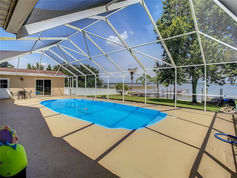 Relax and enjoy your pool and lakefront home.  The "Bonus Room" can be seen at the back of the picture.  It has a full bath with walk-in shower plus 11' x 16' of space you can use for an office, man-cave, exercise room or what ever best fits your families needs.