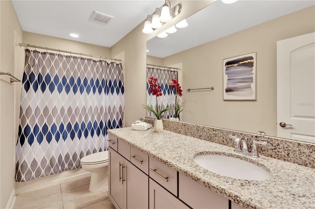 ALL BATHROOMS FEATURE BEAUTIFUL GRANITE COUNTERS & CABINETS