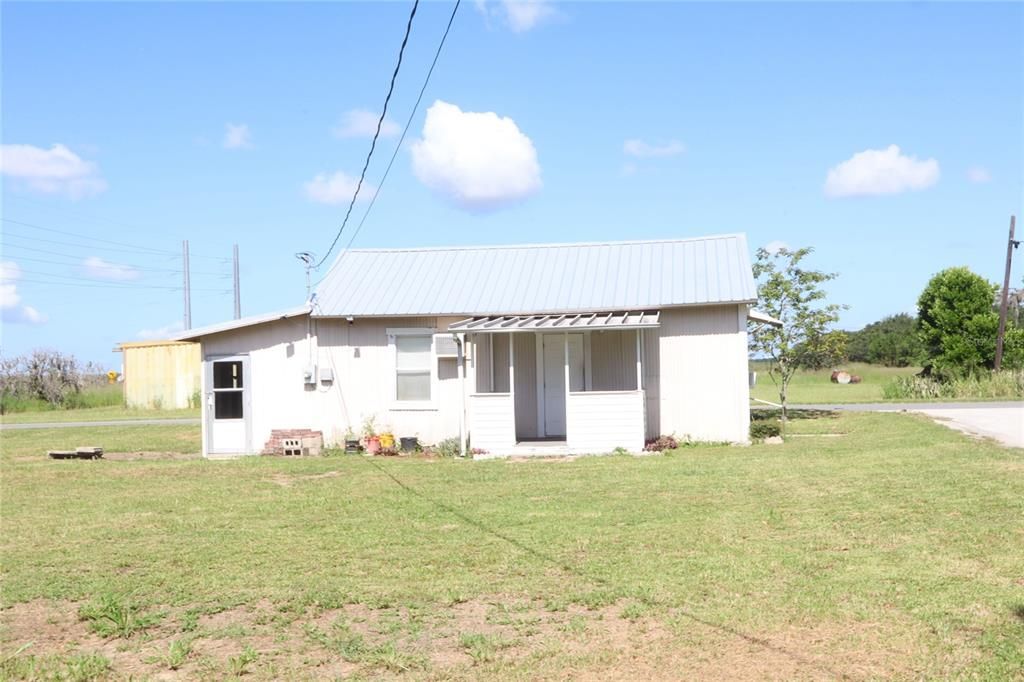 Side view of home with a metal roof.