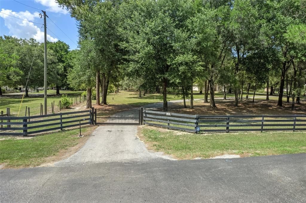 Gated Entrance through the shade trees.