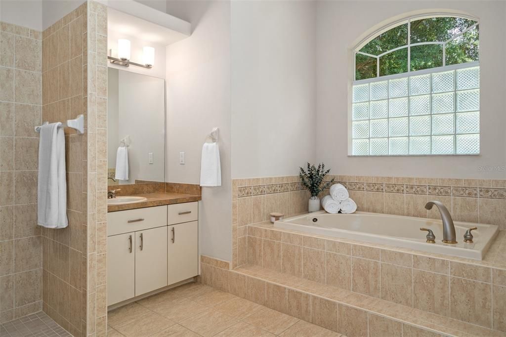 One of 2 vanities in master & soaking tub