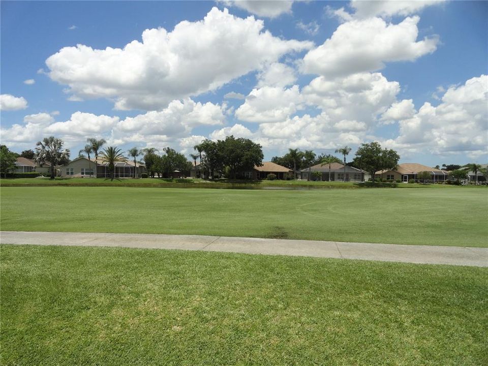 view to rear with fairway and pond