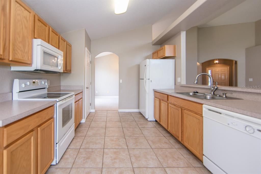 Kitchen offers Tile flooring and Closet Pantry