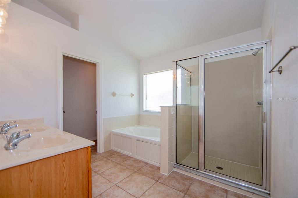 Master Bath offers a Garden Tub and Tiled Shower