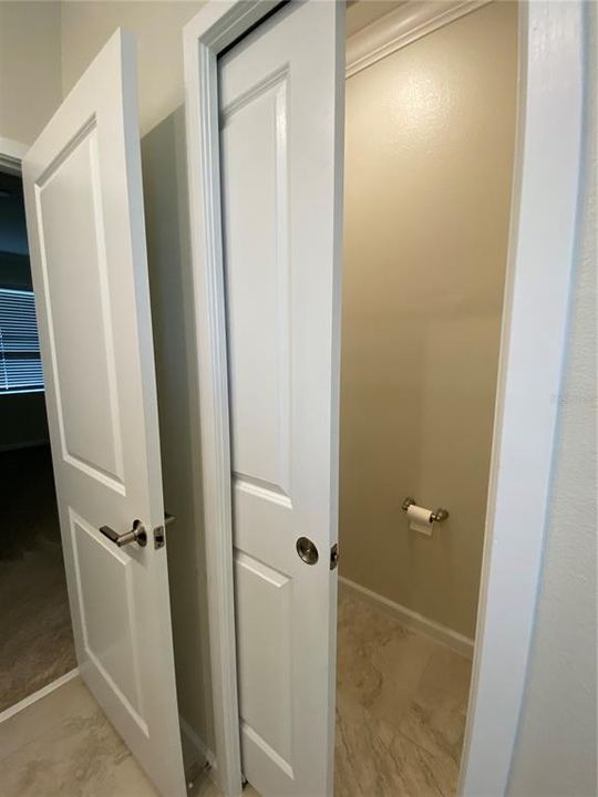 Master Bathroom Toilet with Pocket Door