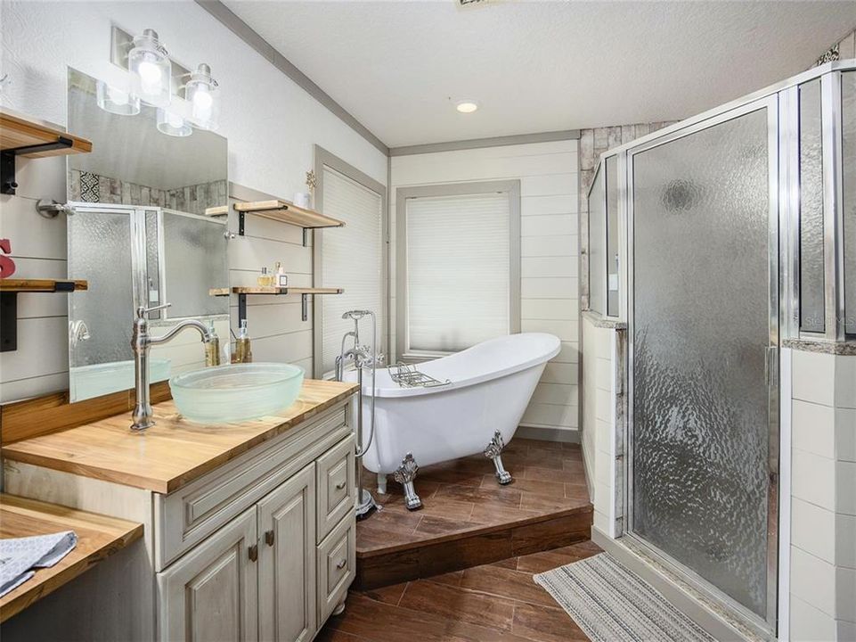 MASTER BATHROOM WITH TUB AND SHOWERS