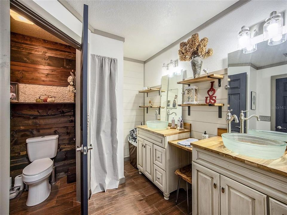 master bathroom with separate toilet room