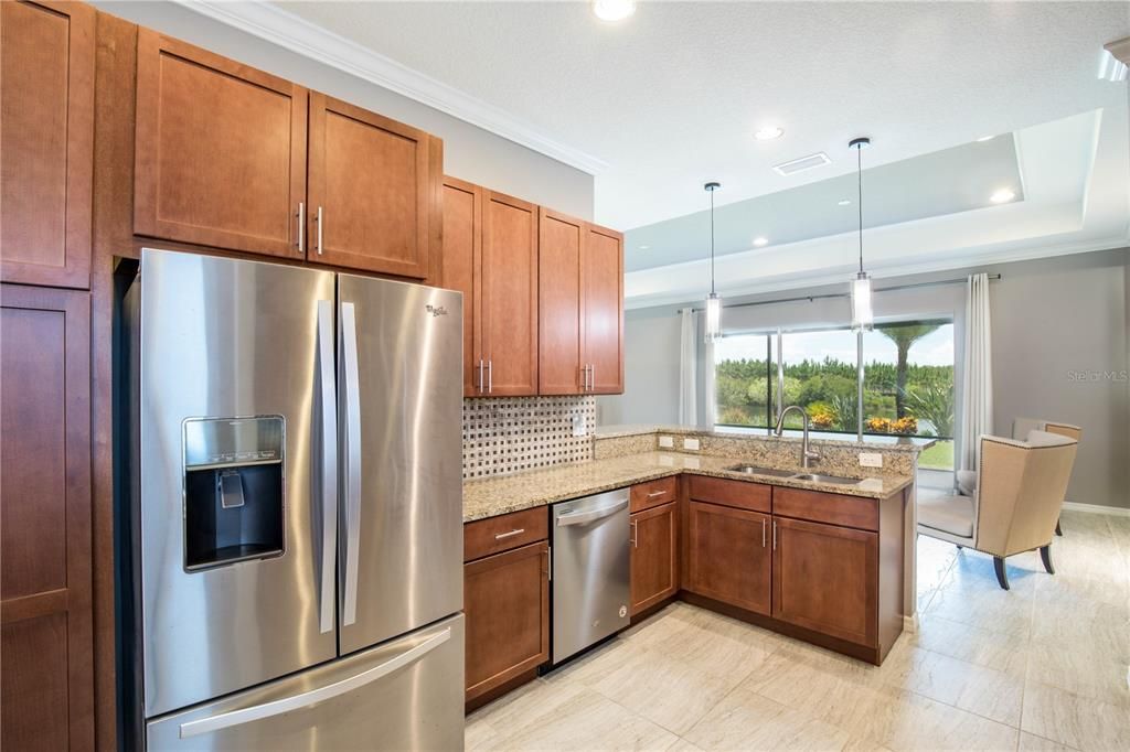 Kitchen features stainless appliances