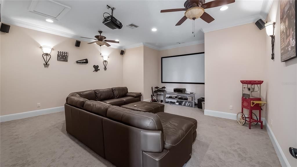 media / theater room above garage