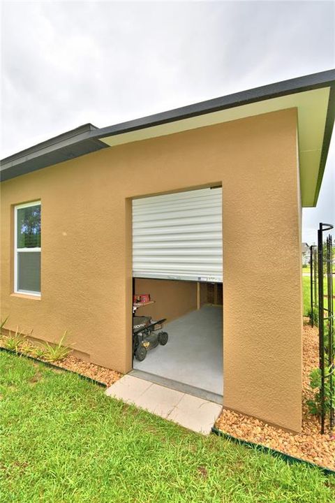 Attached shed with overhead door