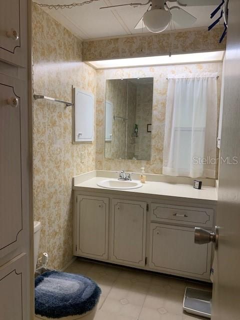 Guest Bath with Tub and shower combo, linen closets on left