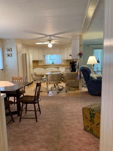 View from Hallway to dining area, kitchen and living area