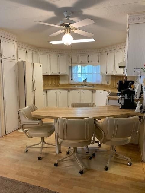 Kitchen, pantry on left, appliance and spice corrals on left and right, eat-in area